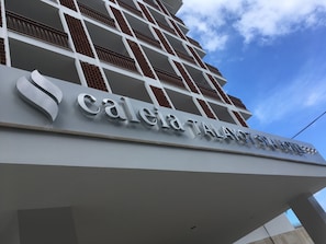 Experience the sleek, modern design of Calea Talat Spa Hotel's exterior, featuring a prominent sign in a bold font.