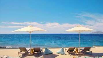 On the beach, sun loungers, beach umbrellas, beach volleyball