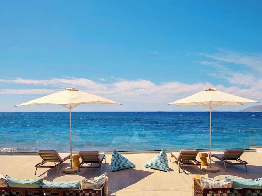 On the beach, sun-loungers, beach umbrellas, beach volleyball