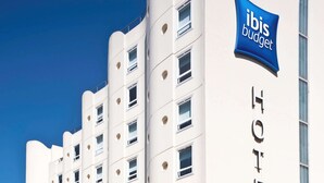 A modern hotel building with a prominent "ibis budget" sign and the word "HOTEL" on the side. - ibis budget Bordeaux Centre Gare Saint Jean (Bordeaux)