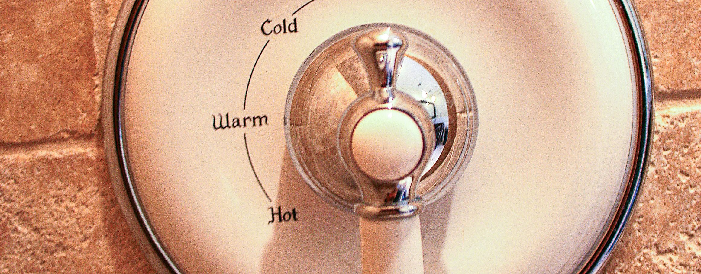 A thermostat with temperature settings labeled 'Cold,' 'Warm,' and 'Hot.'