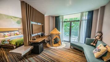 Relax in this inviting room with a comfortable bed, flat-screen TV, and cozy sofa.