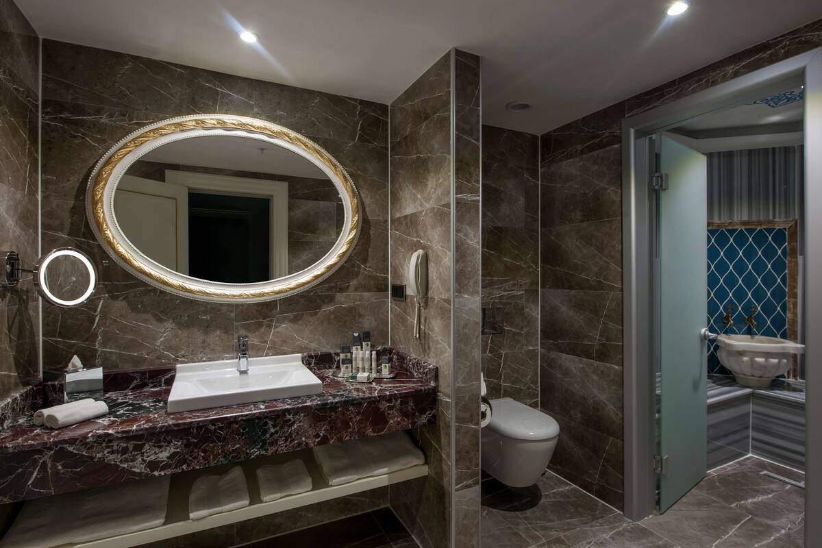 suite, 1 king bed, non smoking (harput) | bathroom | deep-soaking bathtub, hair dryer, slippers, towels