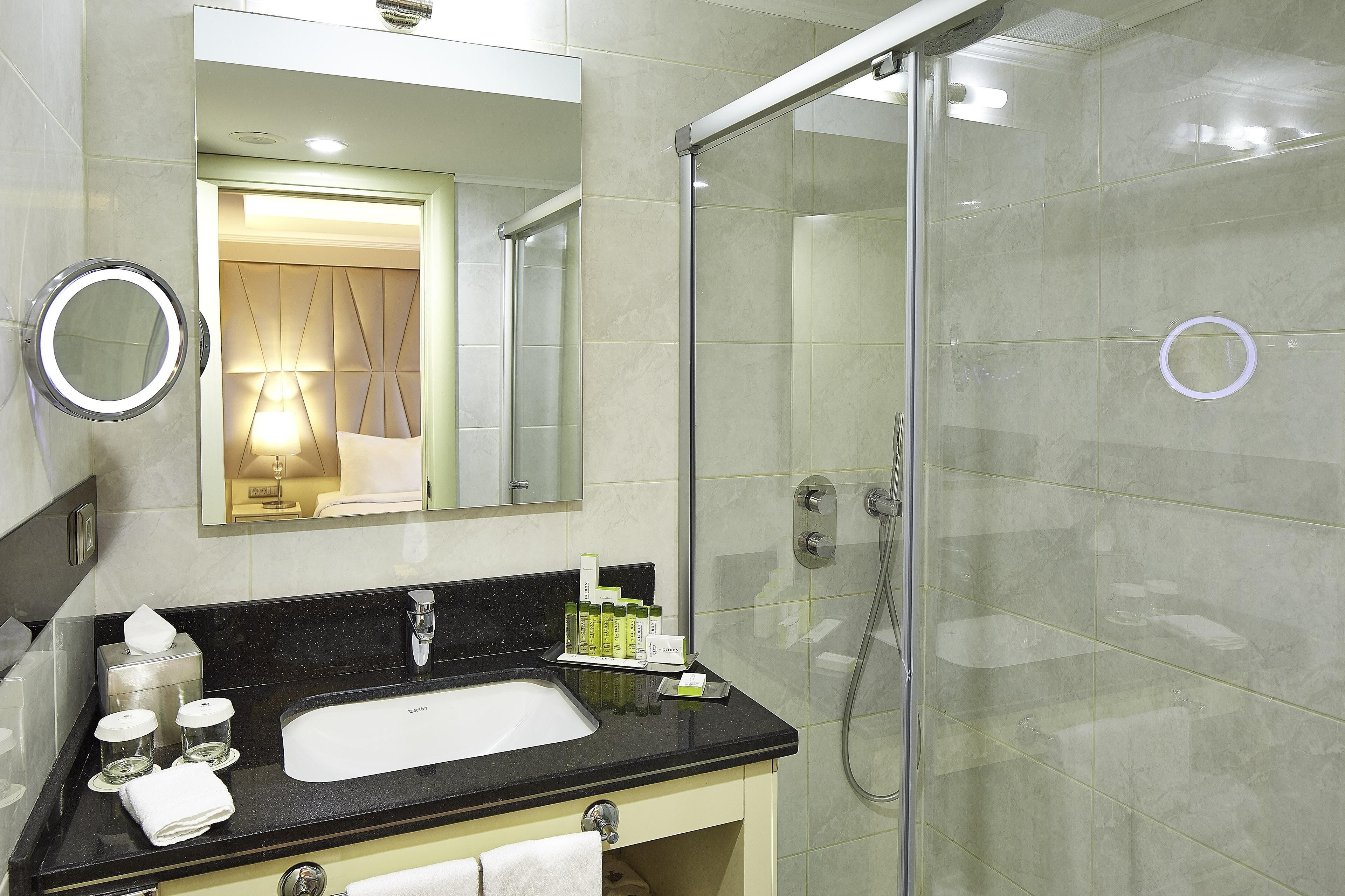 deep-soaking bathtub, hair dryer, slippers, towels