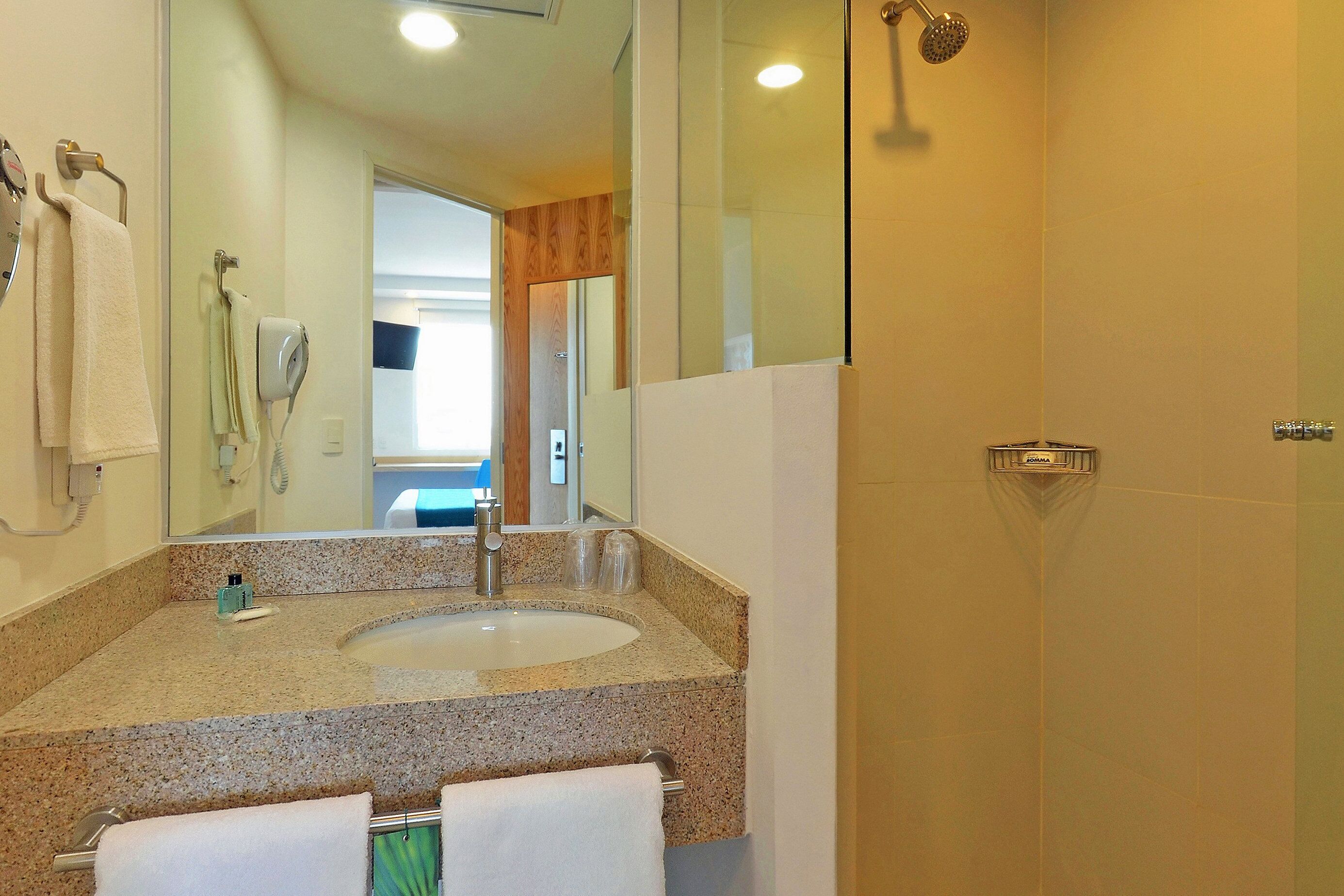 shower, free toiletries, hair dryer, towels