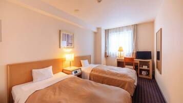 A hotel room with two beds, a desk with a television, a window with curtains, and a painting on the wall.