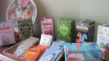 A display of Twinings tea products including Camomile, Matcha Green, and Herbal Selection.
