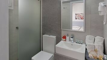 Twin Room (Shared Terrace) | Bathroom | Shower, free toiletries, hair dryer, slippers