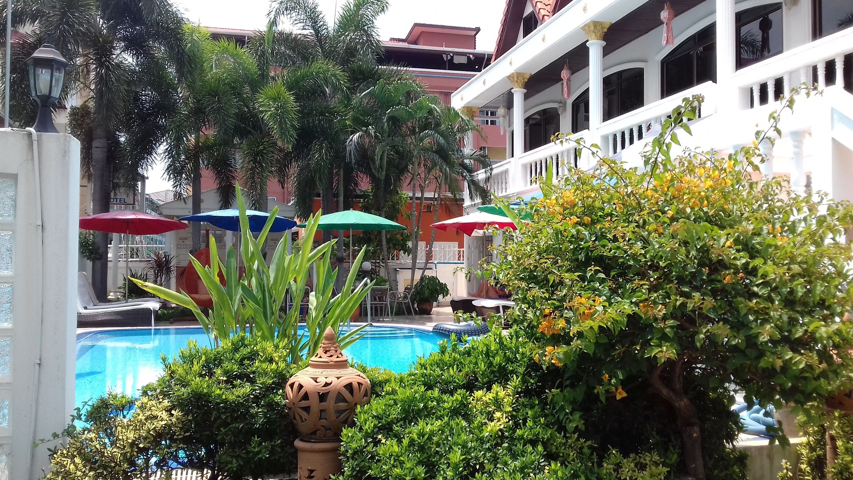 outdoor pool, pool umbrellas, pool loungers