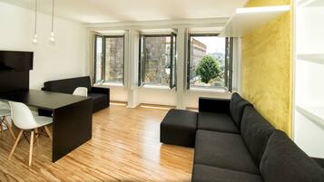 Premium Studio, 1 Double Bed, Kitchen, City View | Living area | 28-inch flat-screen TV with cable channels, TV