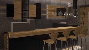 A modern kitchen with a central island, bar stools, pendant lighting, and built-in cabinetry. - Nontas Hotel Apartaments (Chania)