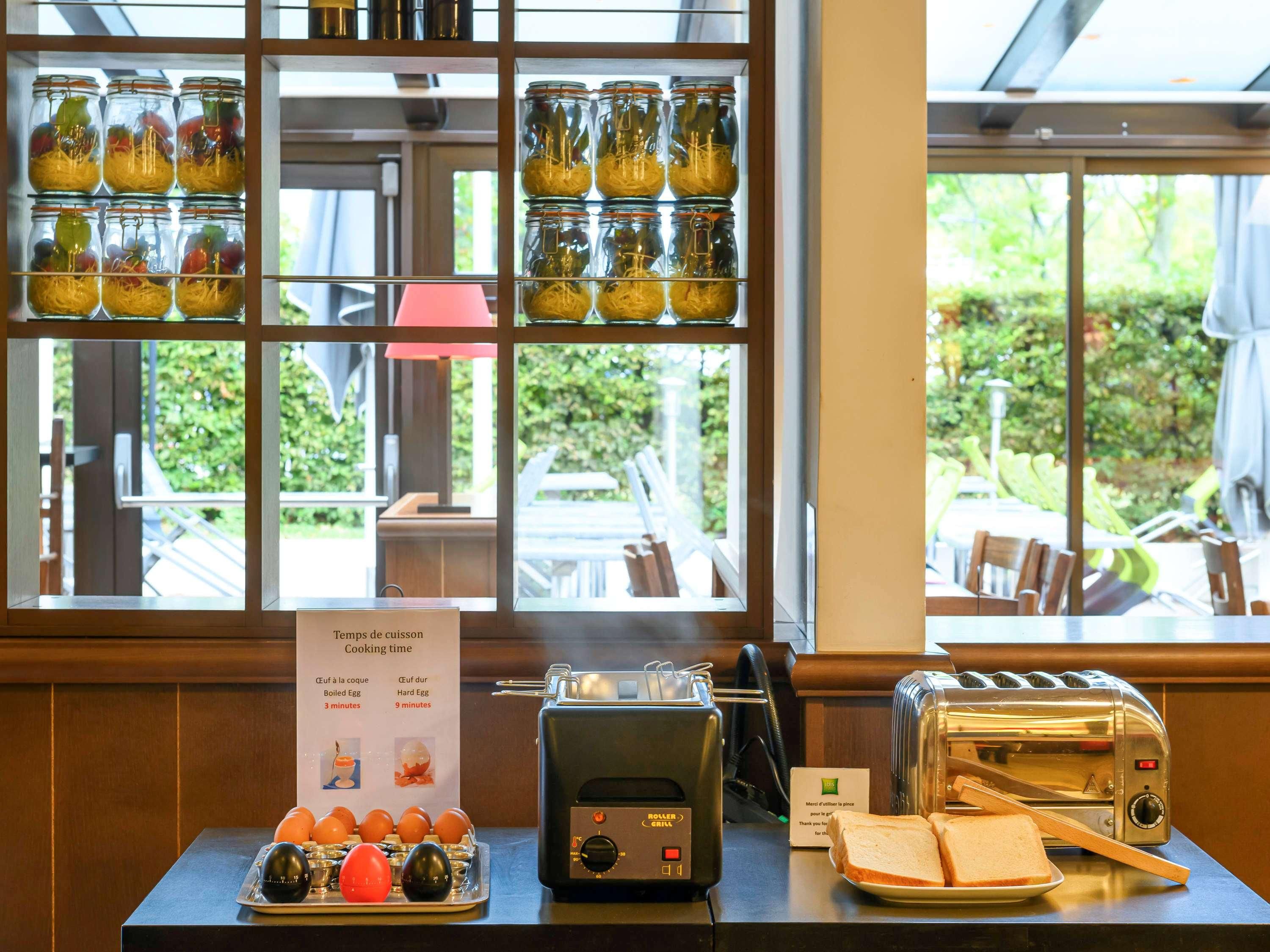 A kitchen area with a display of eggs, a toaster, and a sign indicating cooking times for boiled and hard-boiled eggs.