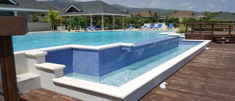 Outdoor pool, pool umbrellas, sun loungers