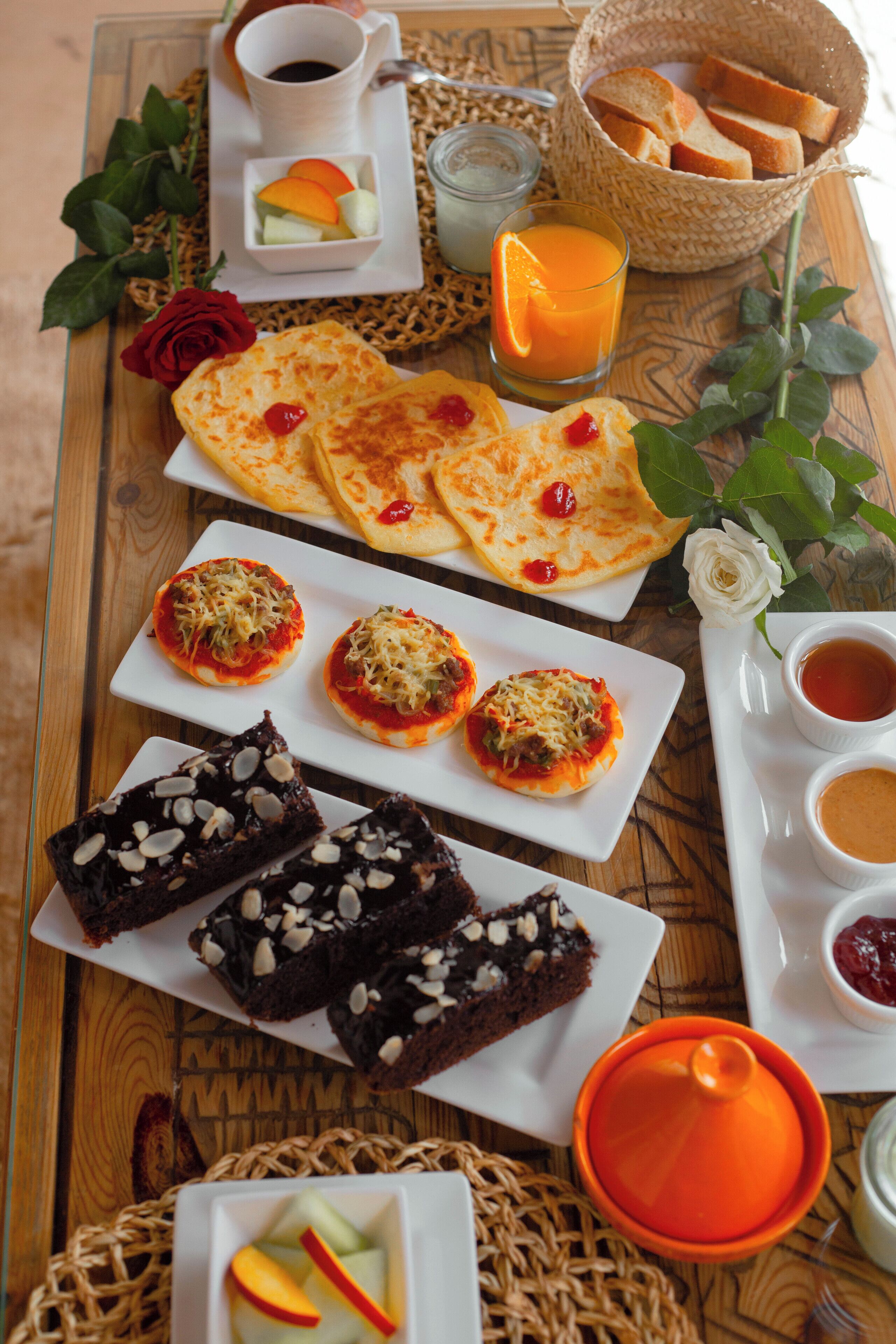 A breakfast tray with various foods and drinks.