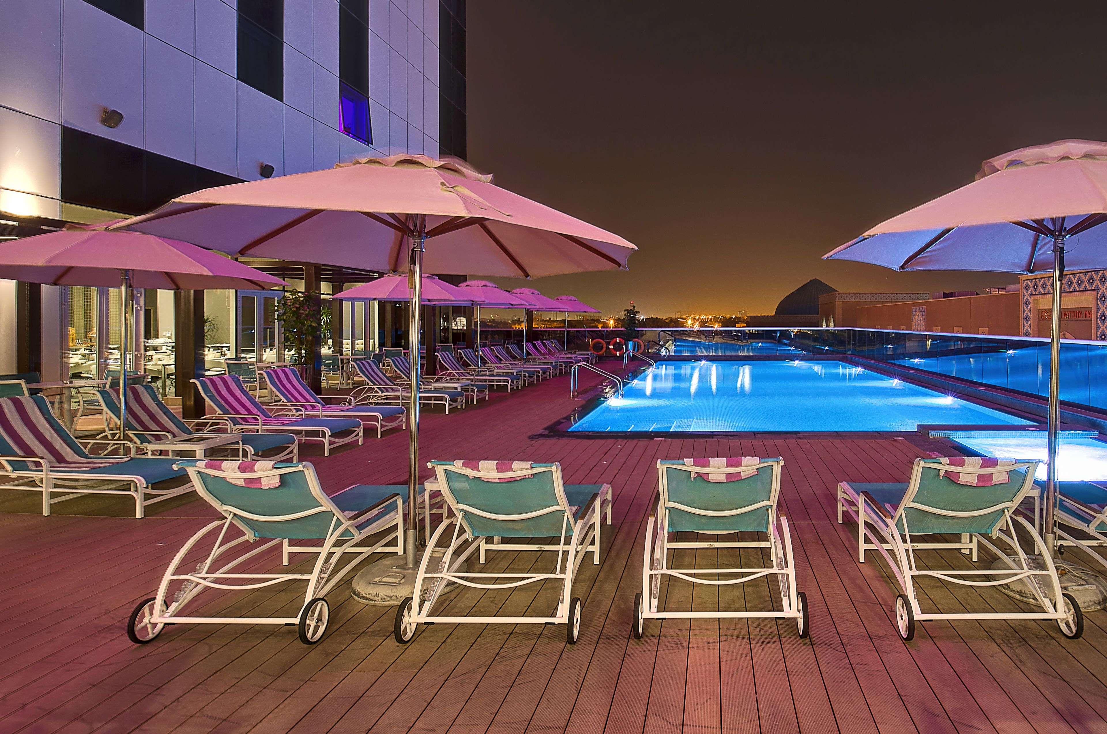 outdoor pool, pool umbrellas, pool loungers