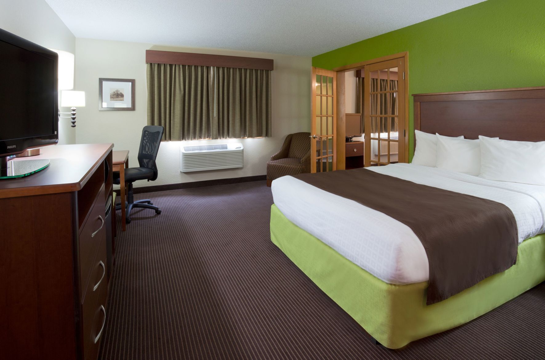 Desk, blackout drapes, iron/ironing board, rollaway beds