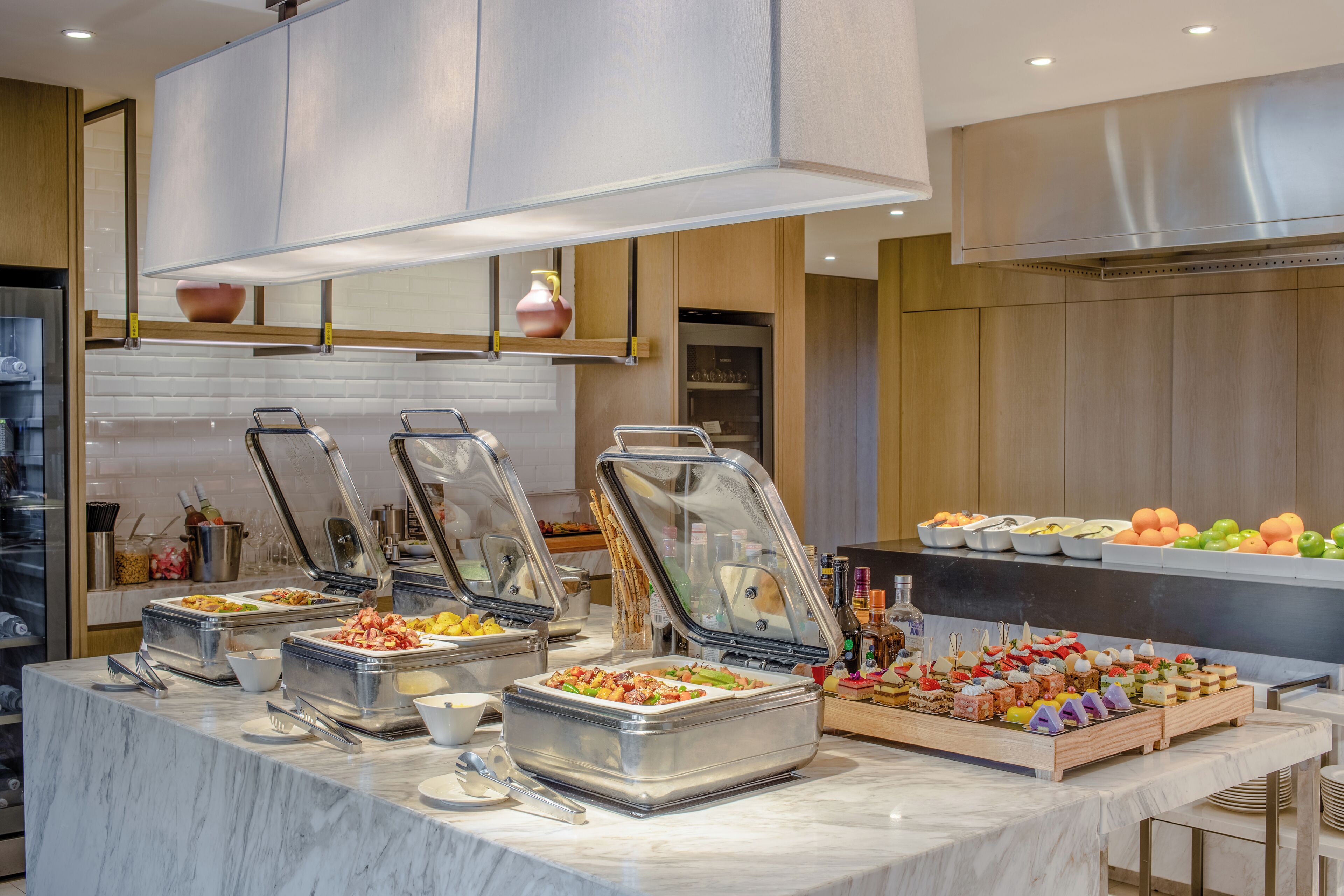 A buffet setup with multiple food stations and a variety of dishes.