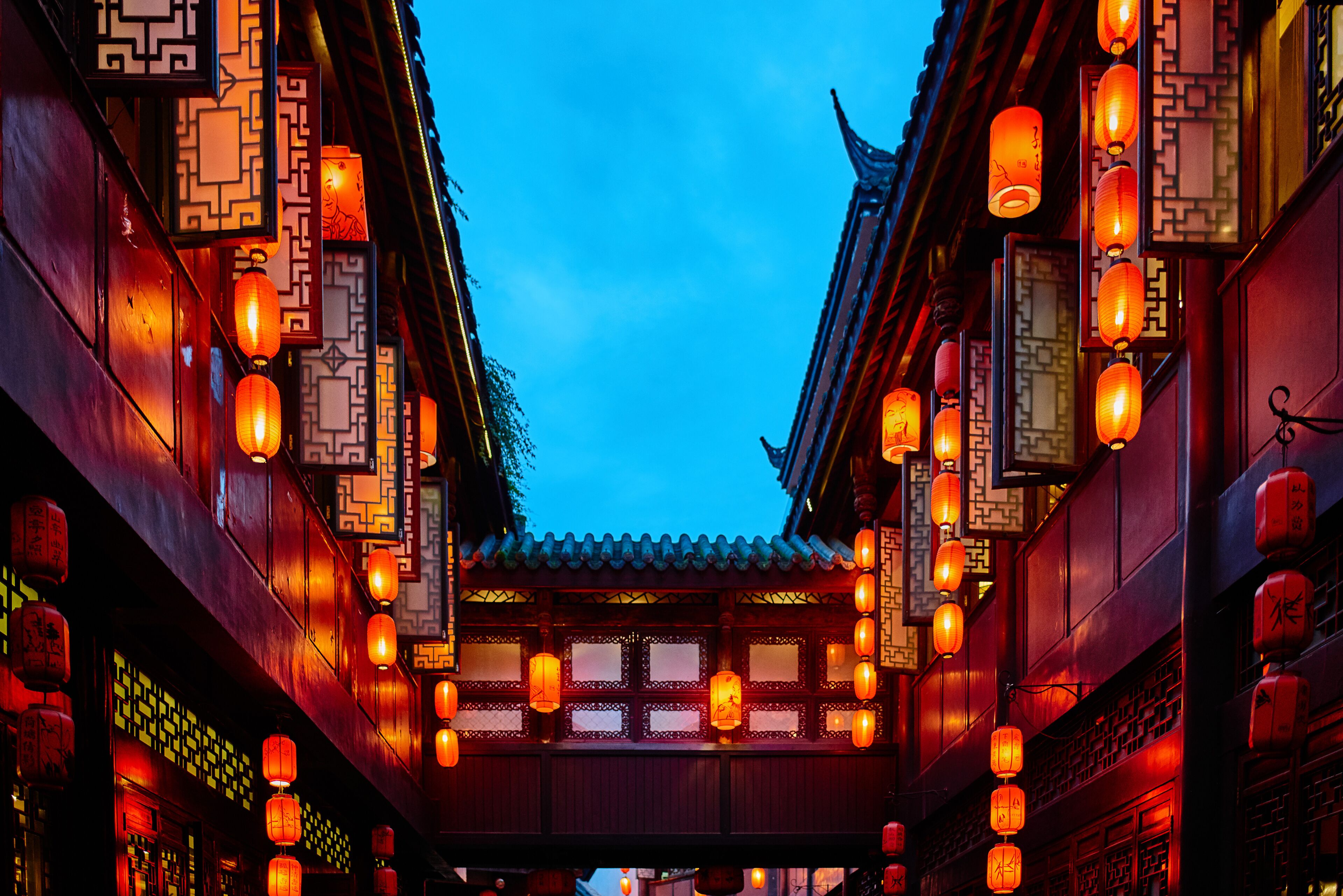 A traditional building with ornate lanterns and wooden architecture.