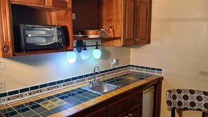 Fridge, microwave, cookware/dishes/utensils