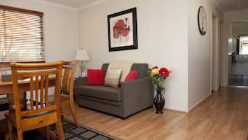 Family 2 Bedroom Cabin Courtside | Living area | Flat-screen TV, DVD player