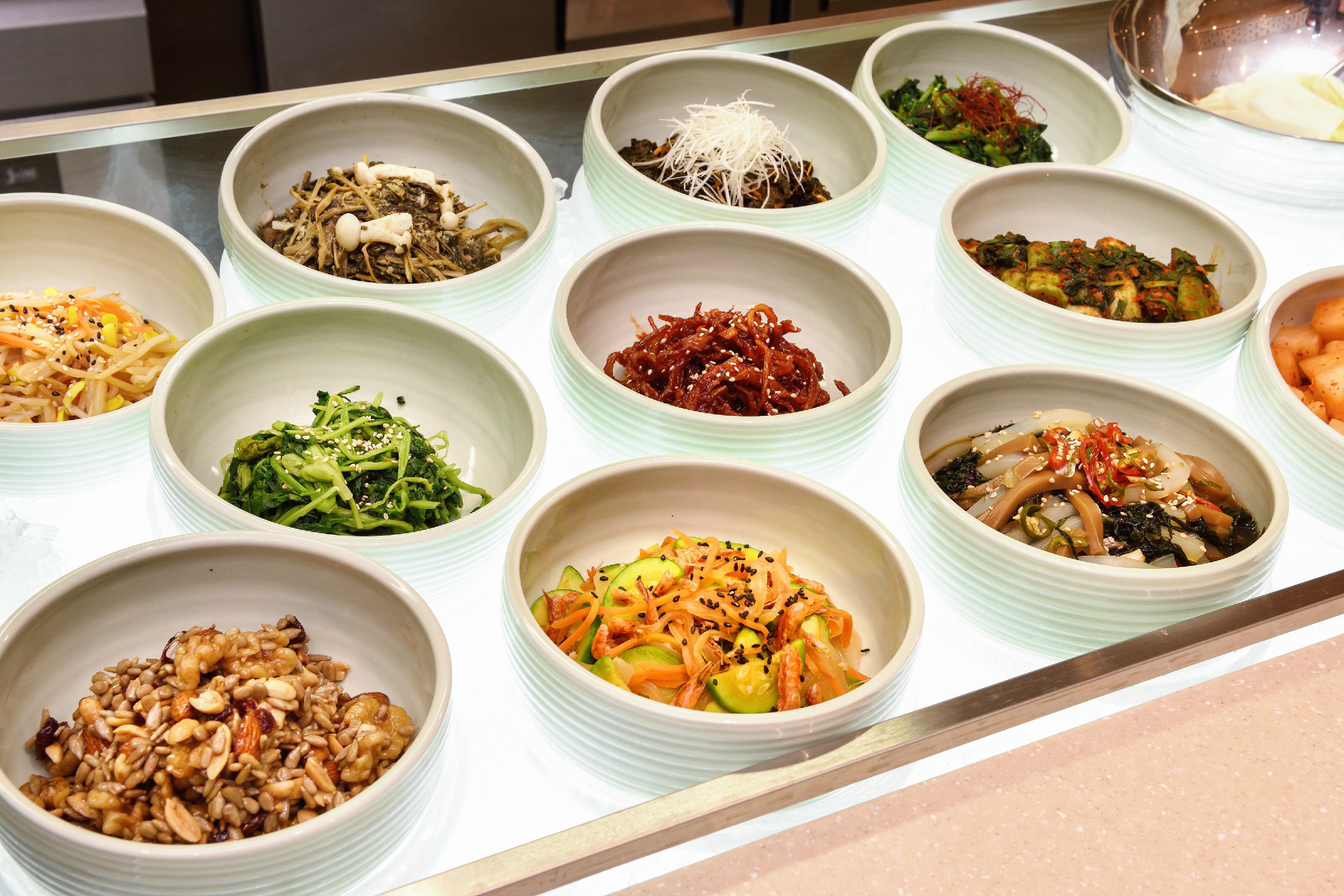 A variety of dishes arranged in bowls on a table.