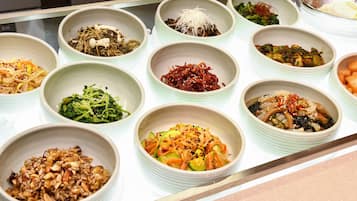 A variety of dishes arranged in bowls on a table.