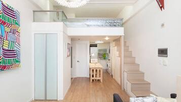 Deluxe Duplex, Private Bathroom | Living room | 32-inch LED TV with cable channels, TV