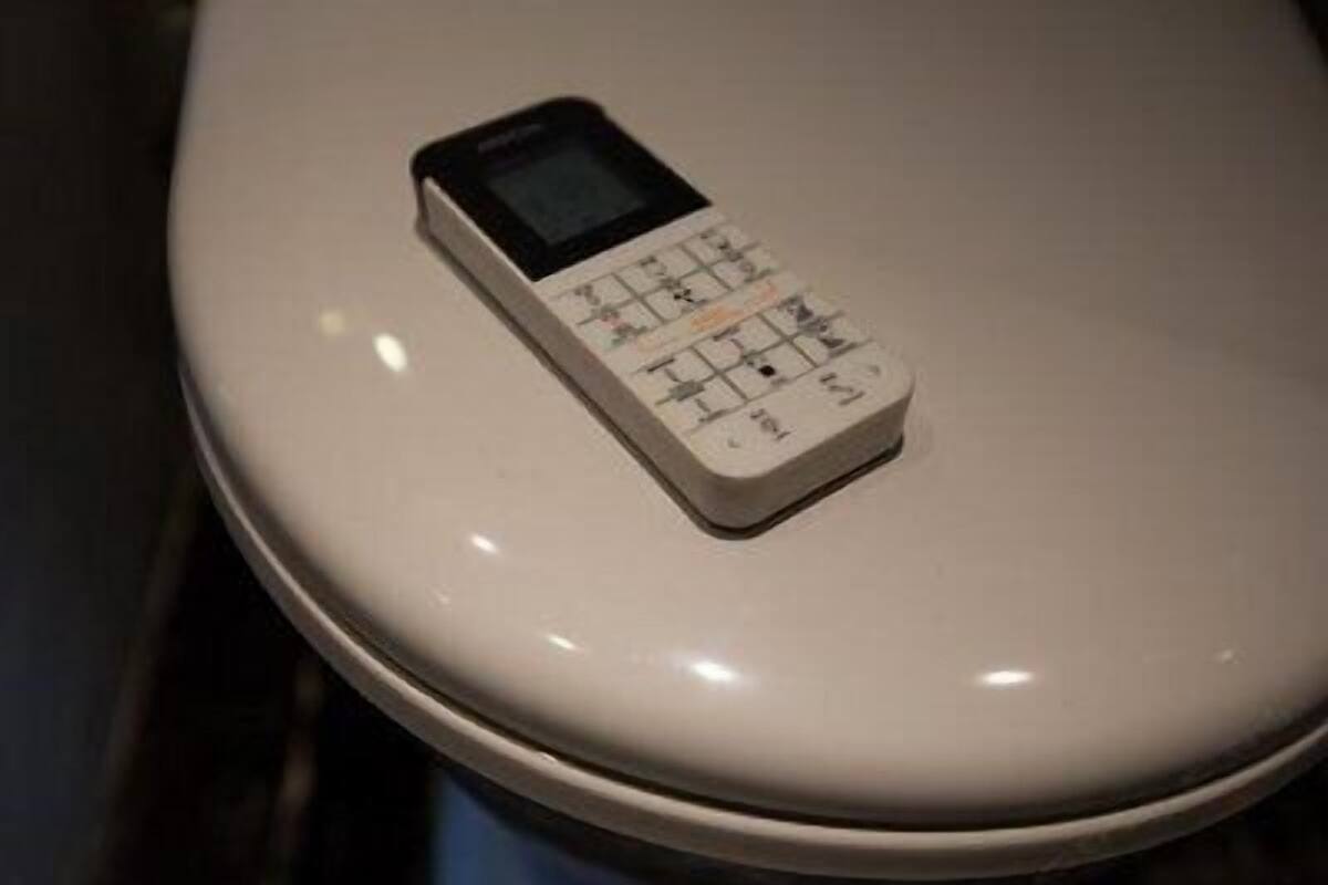A toilet with a built-in control panel.