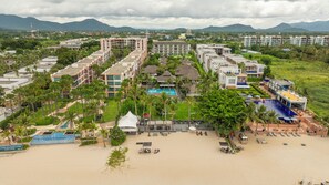 A resort with multiple buildings, a swimming pool, and a beach area. - The Palayana Hua Hin (Cha-am)