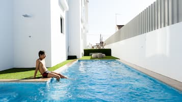 Seasonal outdoor pool, pool loungers