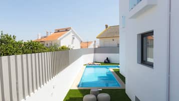 Seasonal outdoor pool, pool loungers