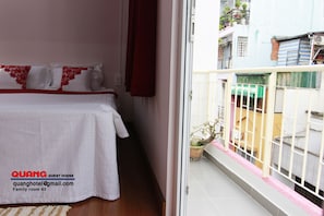 Family Studio, 1 Bedroom, City View | Desk, laptop workspace, blackout curtains, soundproofing - Quang Saigon Hotel (Ho Chi Minh City)