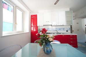 Apartment, 2 Bedrooms (Mansarda sul mare) | Private kitchen | Fridge, stovetop, cookware/dishes/utensils