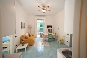 Apartment, 1 Bedroom (Gaetano) | Living room | Flat-screen TV - Palazzo Della Monica (Vietri sul Mare)