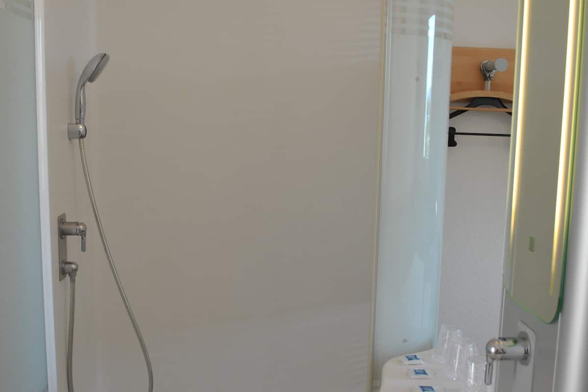 shower, eco-friendly toiletries, hair dryer, towels