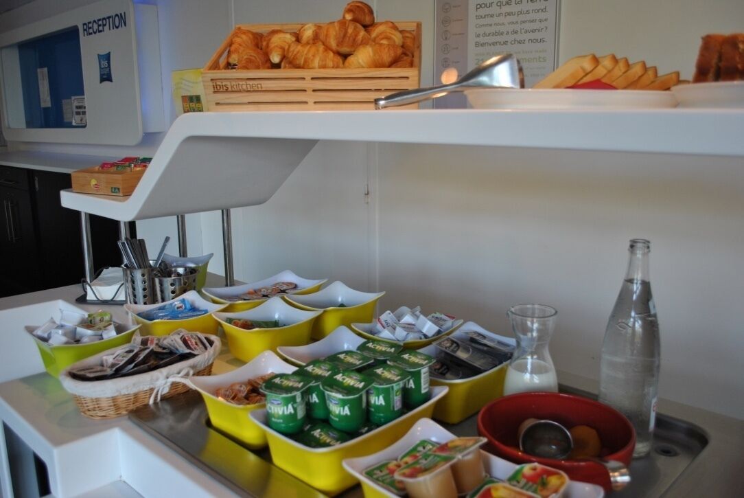A breakfast buffet with various food items and beverages.