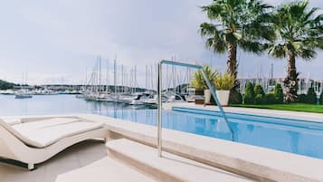 Seasonal outdoor pool, pool umbrellas