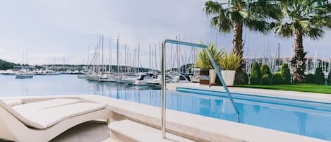 Seasonal outdoor pool, pool umbrellas