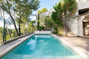 Outdoor pool, pool umbrellas, pool loungers