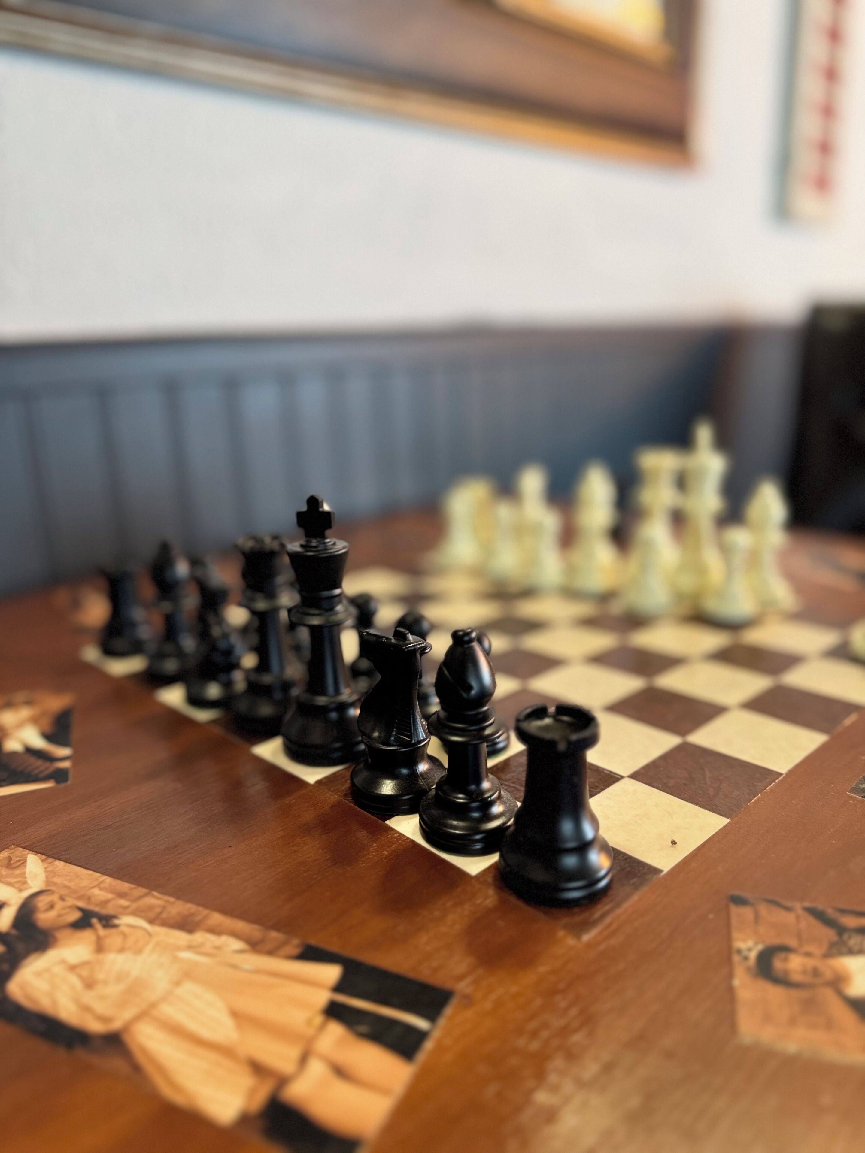 A chessboard with pieces in a game in progress.