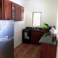 Studio, 1 Bedroom, Pool Access, Pool View | Private kitchen | Full-size fridge, microwave, oven, stovetop