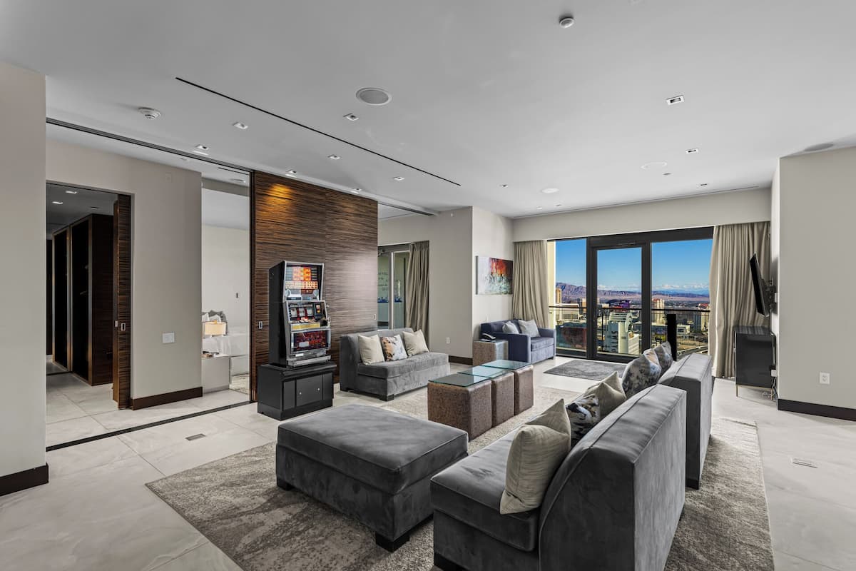 Luxurious Penthouse | Full Strip View | Hot Tub is Unavailable | Living room | 65-inch Smart TV with cable channels, fireplace