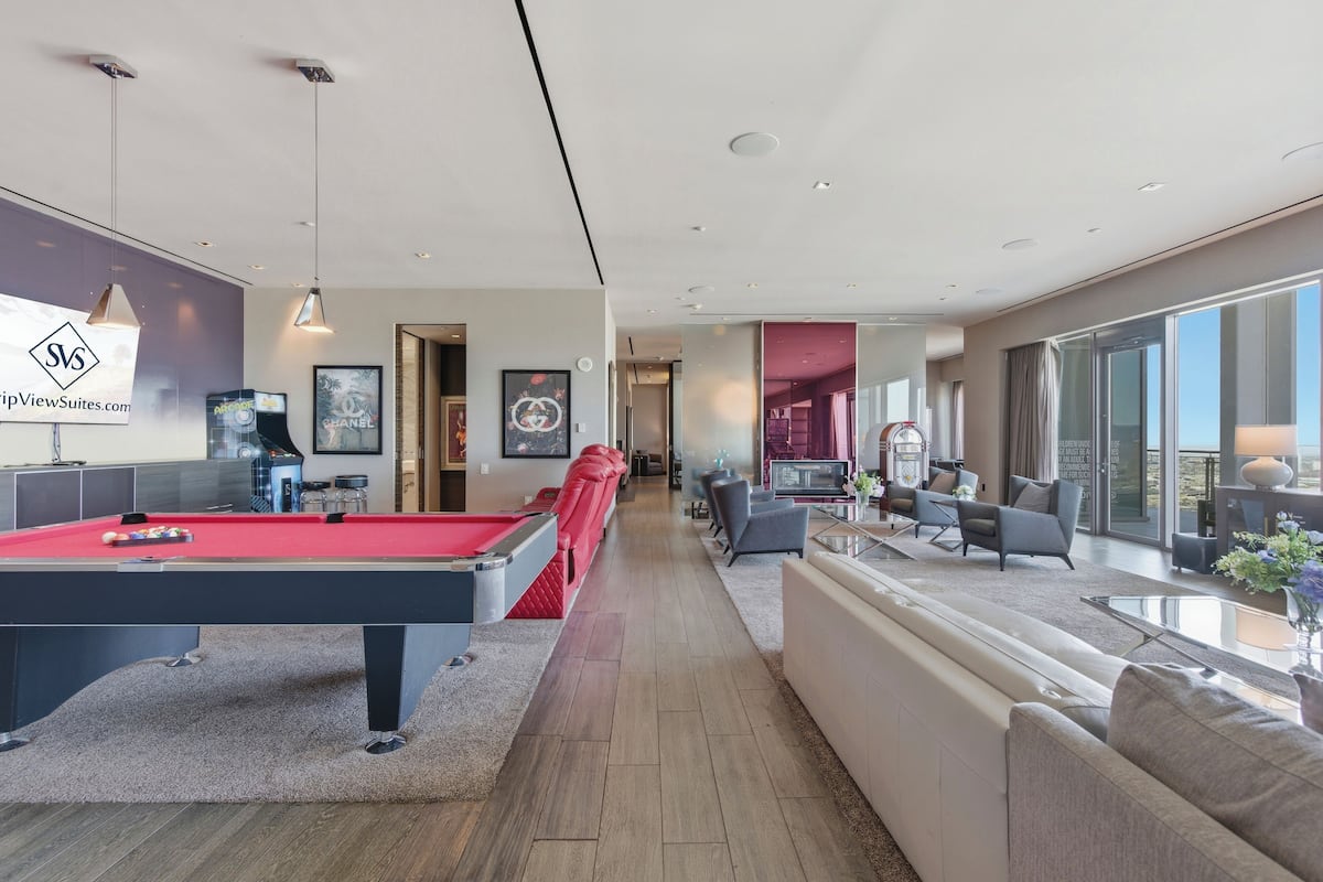 Playboy VIP Penthouse | Jacuzzi on Balcony! | Living area | 65-inch Smart TV with cable channels, fireplace