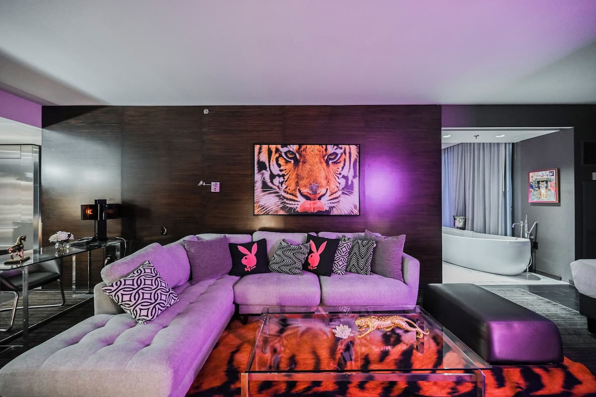 Upgraded One Bedroom - Strip View & Balcony | Living area | 65-inch Smart TV with cable channels, fireplace