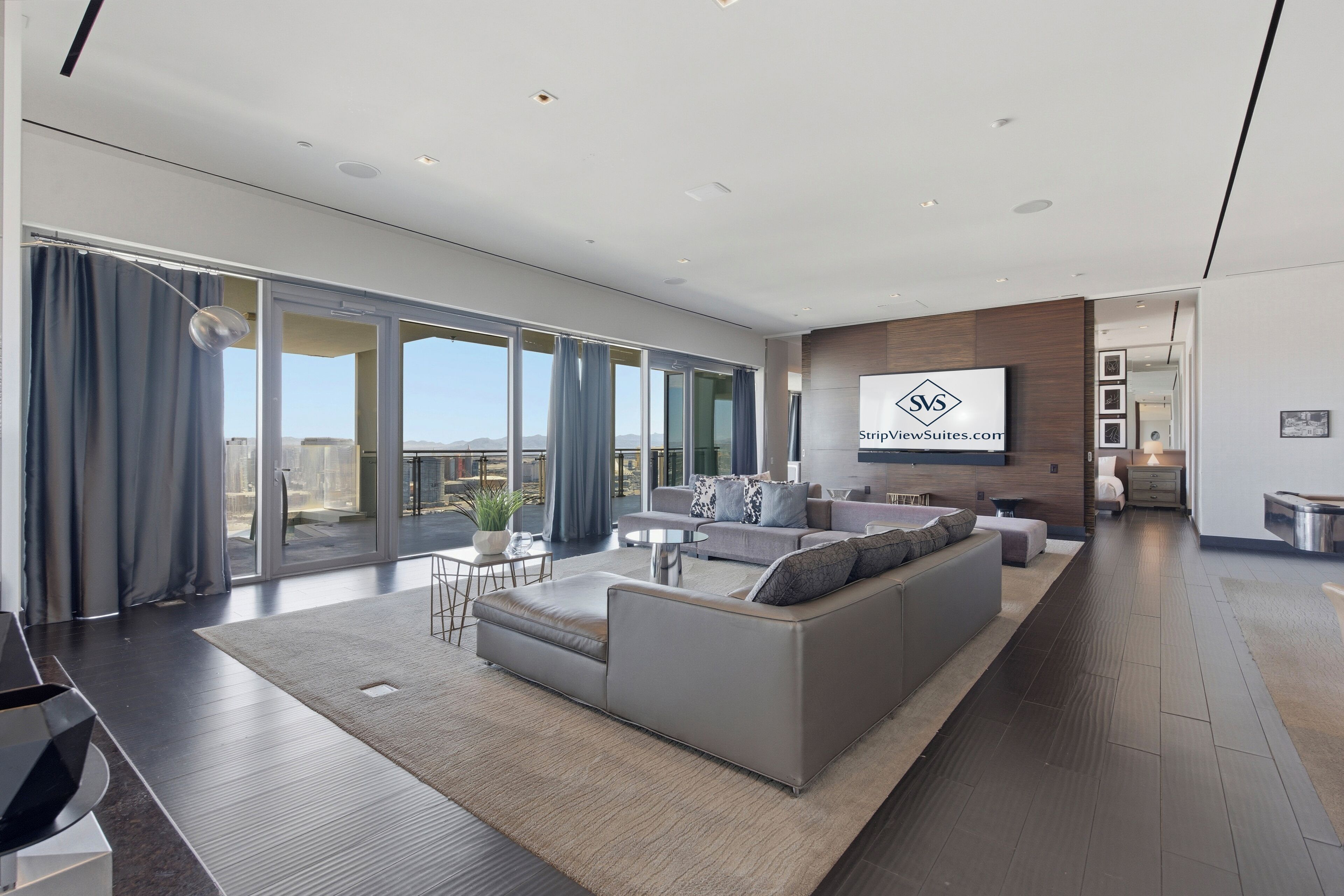 Skyline Penthouse | VIP Strip View Jacuzzi on Balcony! | Living area | 65-inch Smart TV with cable channels, fireplace