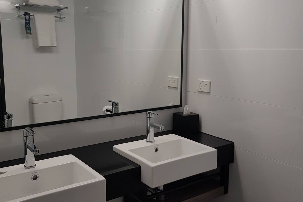 standard room, multiple beds (family) | bathroom sink