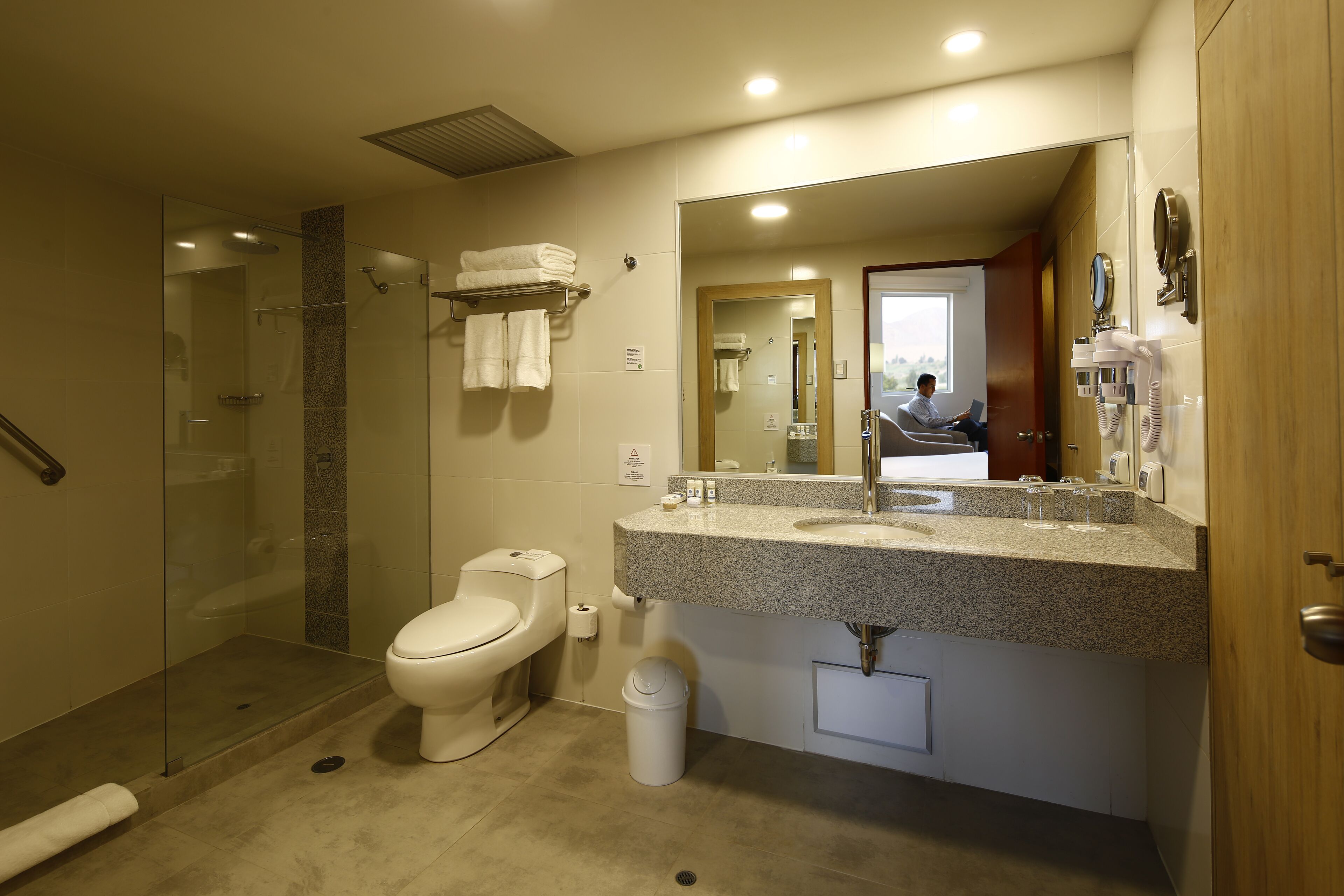 junior suite, 1 king bed | bathroom | shower, designer toiletries, hair dryer, towels