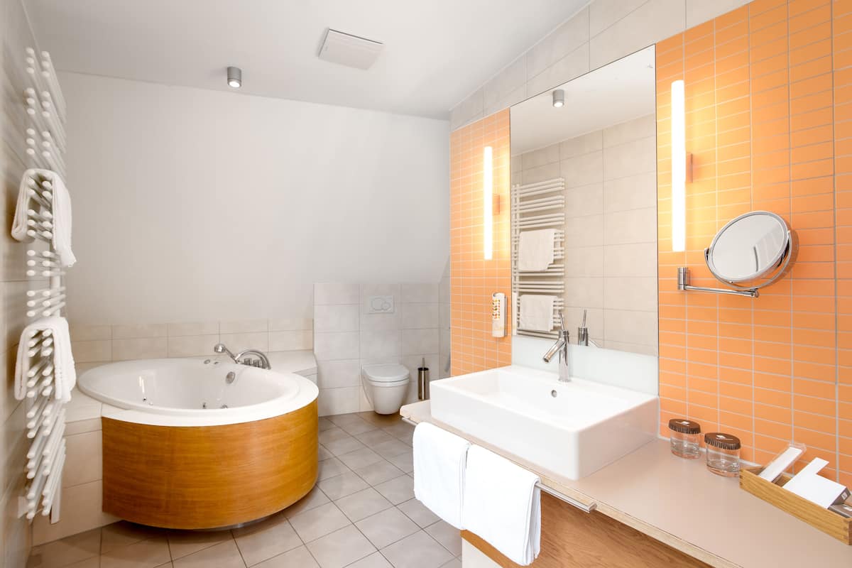 exclusive suite, 2 bedrooms, hot tub, river view | jetted bathtub