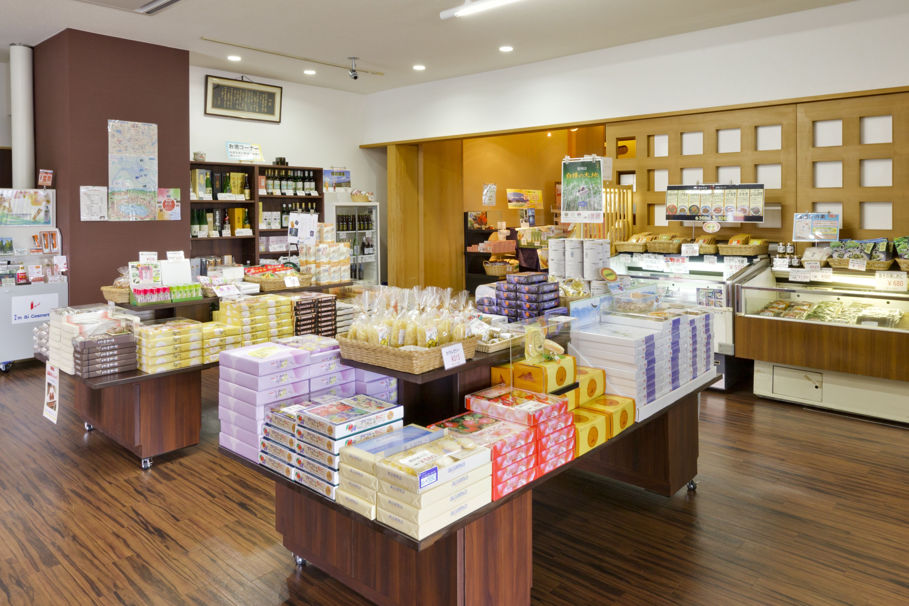 A bakery with various baked goods displayed on shelves and counters.