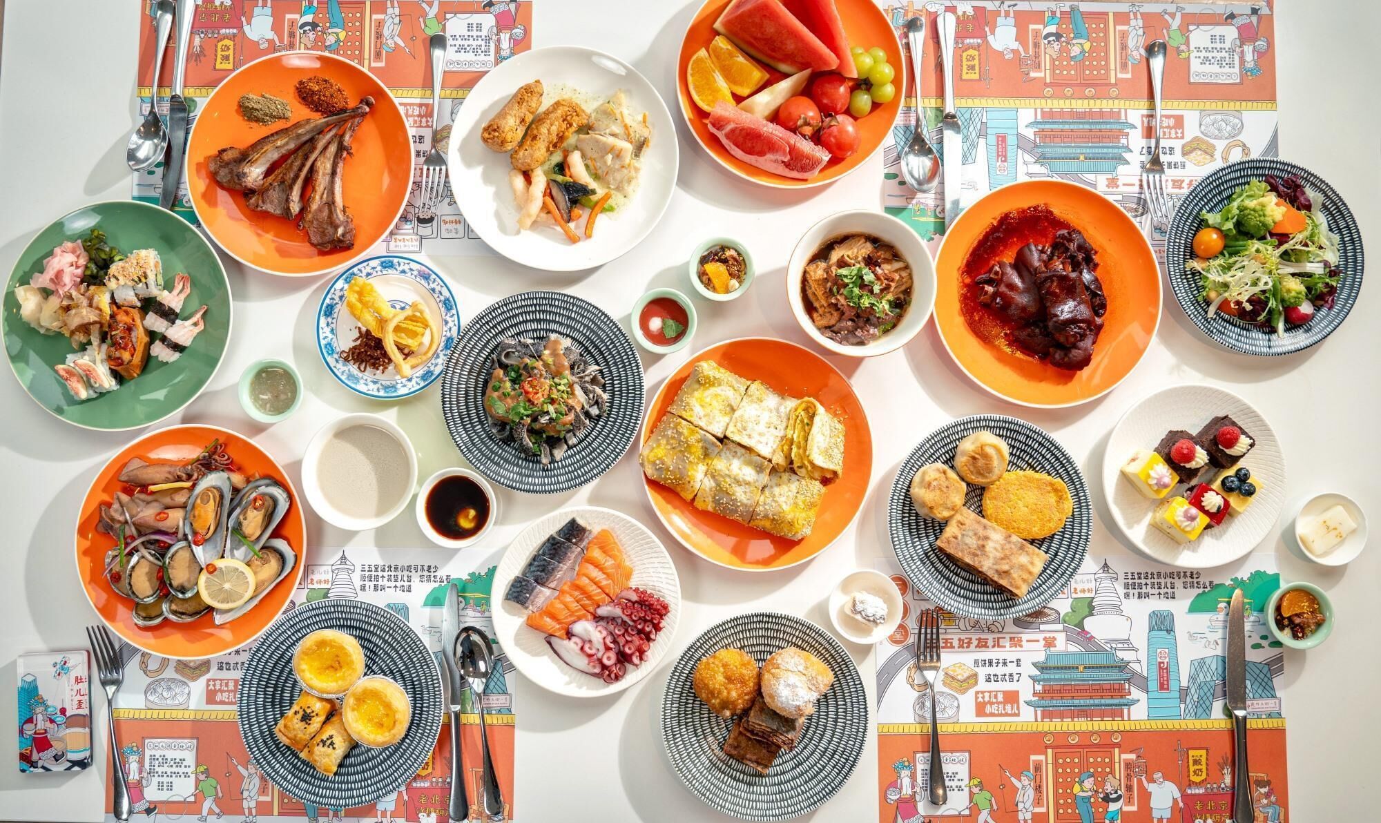 A table with various dishes and a placemat with illustrations.